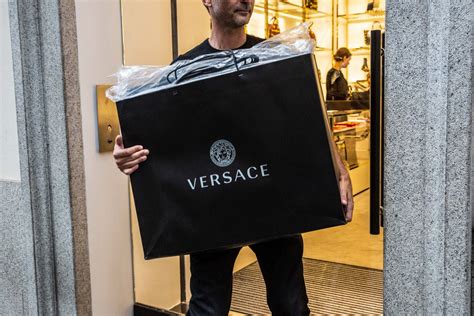 kors buys versace|is versace still in business.